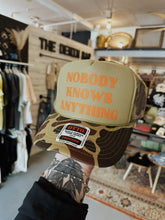 Load image into Gallery viewer, Nobody Knows Anything Trucker Hat
