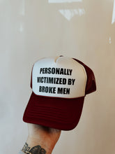 Load image into Gallery viewer, Personally Victimized By Broke Men Trucker Hat
