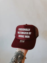 Load image into Gallery viewer, Personally Victimized By Broke Men Trucker Hat
